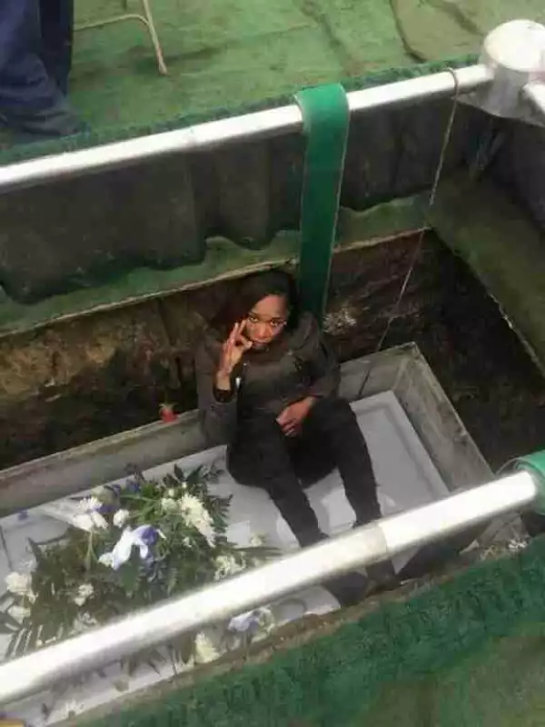 Madness!! See What Ugandan Slay Queen Was Caught Doing In Her Late Mother’s Grave (Photos)